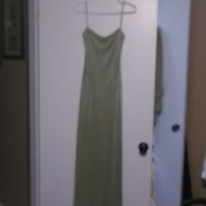 A green shimmery backless evening gowns